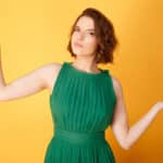 Undecided woman in green dress